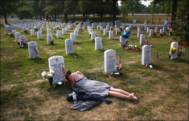 Feature Photo 1st Place. John Moore, Getty Images. Mary McHugh mourns her slain fiance, Sgt. James Regan, a US Army Ranger killed in Iraq, at Arlington National Cemetery May 27, 2007. Mary